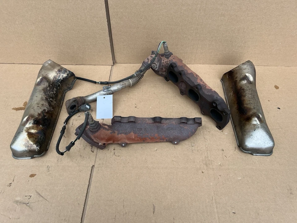 Juego de cabezales de escape A/T ACURA LEGEND 1991-1995 DAÑOS OEM con escudos Foto 1 de 4