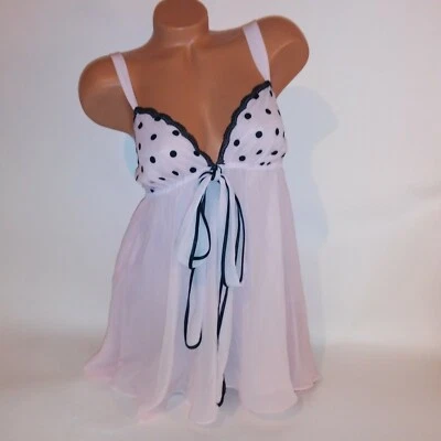 Conjunto de lencería Cinema Etoile babydoll y panty medio rosa negro lunares transparente Foto 1 de 4