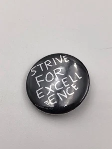 Banksy Original Dismaland ‘Strive For Excell-ence’ Badge - Picture 1 of 2
