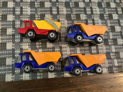 Vintage Matchbox lot of 4 trucks: 3 Atlas Dump Truck #23; 1 Skip Truck #37 - Image 1 of 4