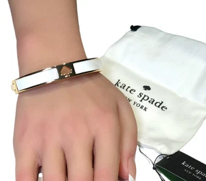 NWT Auth Kate Spade Hole Punch Spade Bangle Bracelet White & Gold - Picture 1 of 8