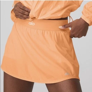 Alo Yoga Match Point Tennisrock Cantaloupe M - Bild 1 von 6