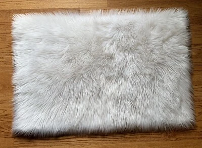 Safavieh Faux Sheep Skin 2' x 3' Creamy White Ivory Accent Fur Throw Rug - Image 1 of 4
