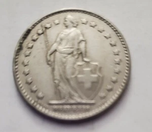 1977 1 FRANC HELVETIA STANDING WITH SPEAR AND SHIELD SURROUNDED IN STARS  - Picture 1 of 2