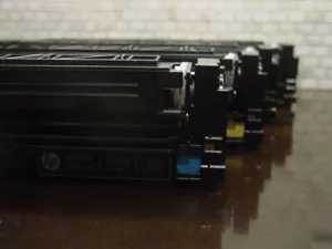 Set of 4 USED Genuine HP 201A CYMK Color Toner Ink Cartridges BLACK/CYAN EMPTY - Picture 1 of 4
