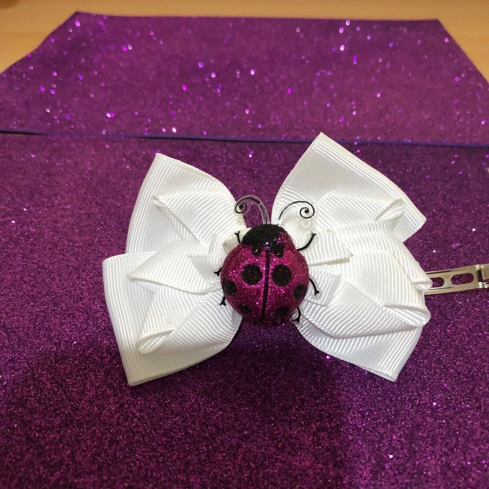 Girls barrette white bow with pink ladybug - Image 1 of 1