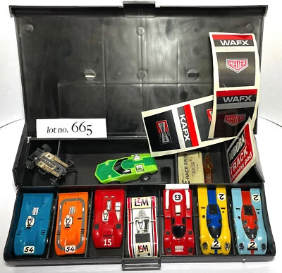 Lote 665 8 piezas nuevos coches ranurados AURORA AFX Non-Mag HO 1972 stock antiguo colección sin usar Foto 1 de 3