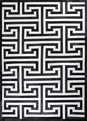 Nueva alfombra moderna de cuero de vaca hecha a mano negra blanca - varios tamaños Foto 1 de 4