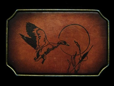 MB11102 VINTAGE 1970s **DUCK FLYING OVER CATTAILS** LEATHER BELT BUCKLE - Image 1 of 2