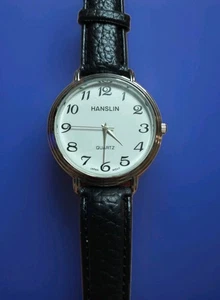 Hanslin Quarz Armbanduhr mit einem weißen Zifferblatt silbernes Gehäuse und einem schwarzen Lederband - Bild 1 von 11