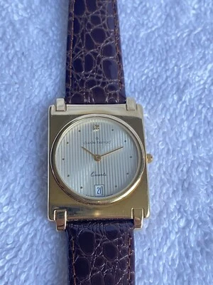 Reloj suizo vintage delgado Claude Bernard, fecha dorada y acero cuarzo Foto 1 de 4