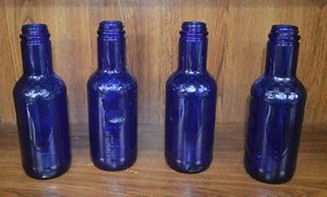 4er Set Kobaltblaue Glasflaschen mit Greifern 1994 - Bild 1 von 5