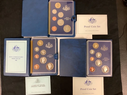 (3) 1985,1986,1987 Royal Australian Mint Proof Coin Set of 7 coins in each set!! Cover