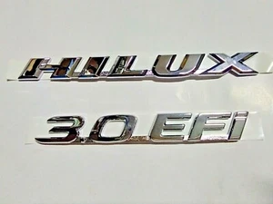 Genuine Toyota Hilux D4D pickup logo side emblem badge plate decals Hilux 3.0EFI - Picture 1 of 12