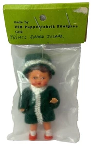 NEW IN PACKAGE VEB Puppenfabrik Konigsee GDR 3" Miniature Rubber Doll Green Coat - Picture 1 of 4