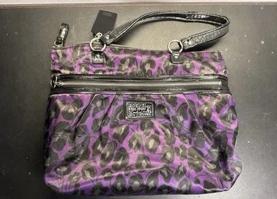 Monedero Coach Poppy Daisy púrpura y negro con estampado de ocelote Foto 1 de 4
