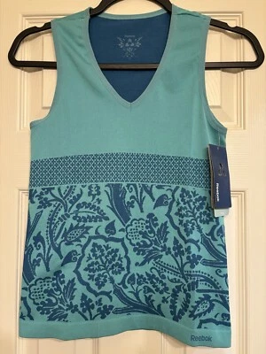 NUEVO CON ETIQUETAS - Camiseta sin mangas ajustada Reebok para mujer sin costuras talla pequeña yoga correr - azul Foto 1 de 4