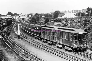 pu3195 - District Railway Loco's departing Ealing Broadway - print 6x4 - Picture 1 of 1