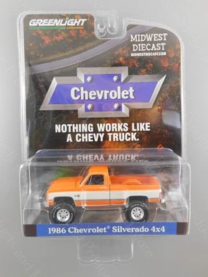 Greenlight 1986 Chevrolet Silverado 4 x 4 Orange & White Lifted Truck 1:64 Scale - Image 1 of 3