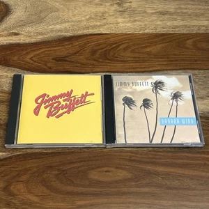 Jimmy Buffett - 2 CD Lot - Songs You Know By Heart & Banana Wind - Foto 1 di 7