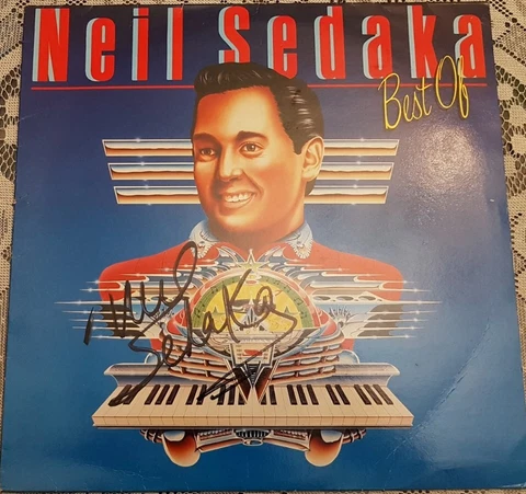 Neil Sedaka, music legend, signed album cover. With AFTAL COA Cover