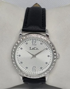Mujer L&Co. Reloj con correa de cuero negro estrás esfera plateada redonda 06 - Imagen 1 de 9