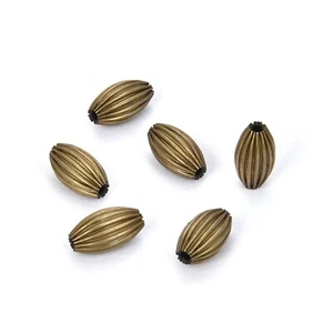 200pcs Beautiful Melon Spacer 7mm x 4mm Corrugated Oval Rice Shape Metal Loos... - Picture 1 of 4