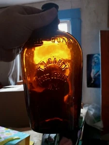 Amber T.J. Carty Port Jervis New York Embossed Slugplate Strap Flask - Picture 1 of 9