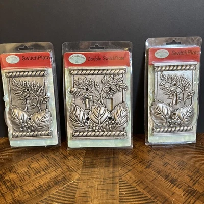 Lote de placas de interruptor de hoja de peltre cálido Woodlands - 2 individuales + 1 doble nuevas en paquete Foto 1 de 4
