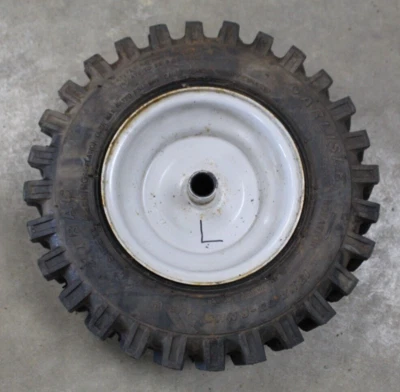 TROYBILT 24" LH RIM AN TIRE 13X4.00-6 634-04167A - SHELF C - Image 1 of 3