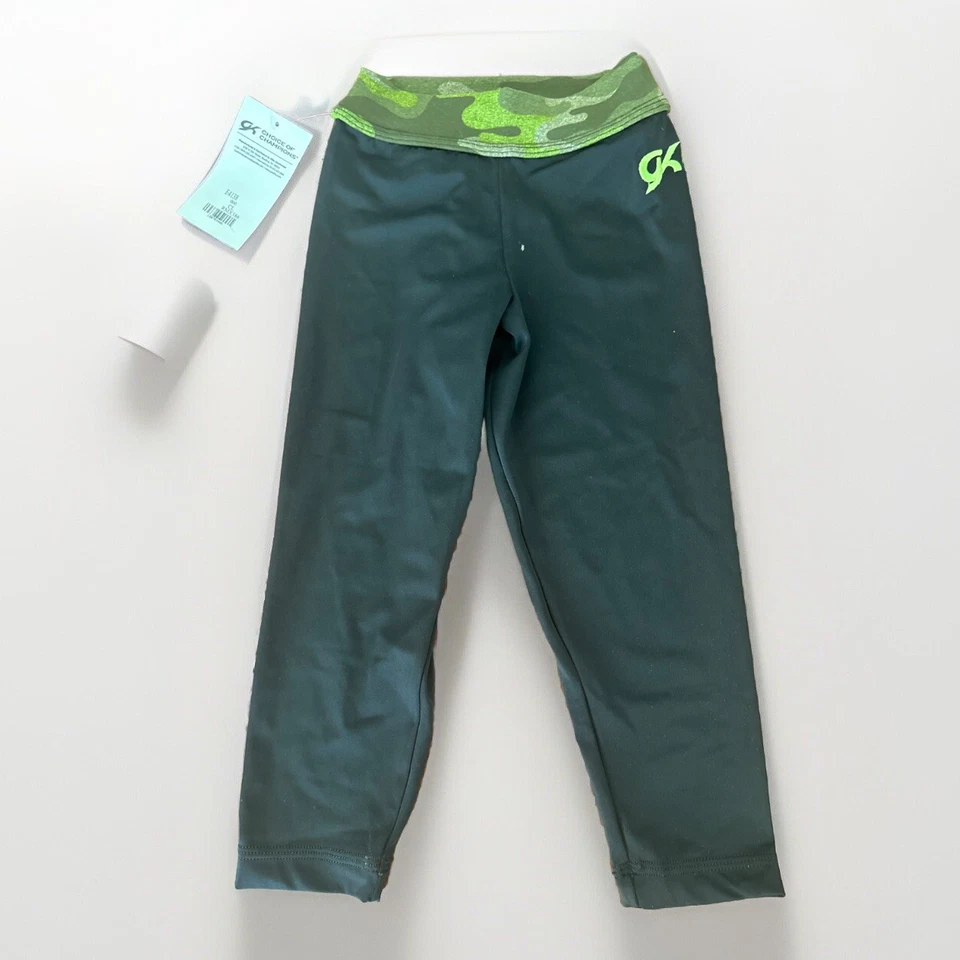 NUEVO CON ETIQUETAS LEGGINGS GK Elite Gimnasia PANTALONES NEGROS camuflaje Capri SPANDEX Niñas talla CL Foto 1 de 4