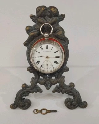 Antique Victorian Cherub Pocket Watch Stand & Silver key Wind Pocket Watch. W/O. - Image 1 of 4
