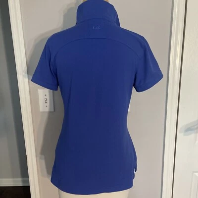 Camisa polo de manga corta Cutter & Buck azul mediano Drytec para mujer. Foto 1 de 4