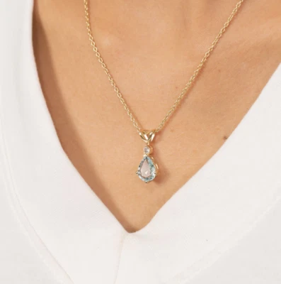 Colgante solitario de aguamarina de 1 quilate corte pera creado en laboratorio de oro amarillo de 14 quilates Foto 1 de 4