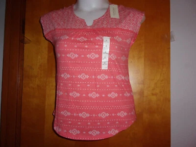 NUEVO EQUIPO SIN MANGAS SOMONA PARA DAMA CON CUELLO EN V BLANCO con JERSEY NARANJA DIAMANTE  Foto 1 de 4