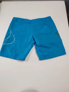 XCEL blue surf shorts, with one right-side pocket, size 9 (WUV6) - Picture 1 of 3