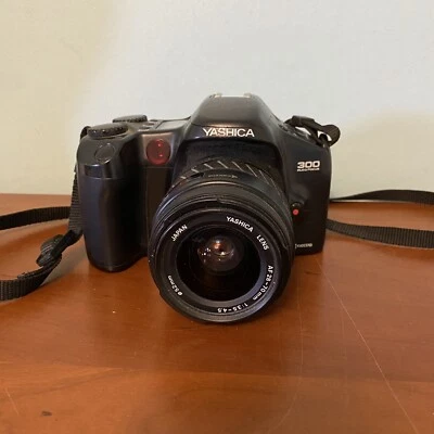 Yashica 300 Auto Focus Kyocera 35MM SLR FILM camera 28-70MM Zoom WORKING TESTED - Image 1 of 4