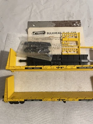 Roundhouse HO TTX Trailer Train 60' Bulkhead Flat Car Kit and one complete - Image 1 of 3