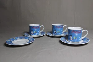 3 COCA-COLA Cups & 4 Saucers In The Laughing Snowman Pattern - Picture 1 of 7