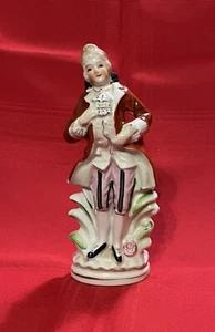 Estatuilla de porcelana colonial pintada a mano vintage hombre con abrigo largo Japón - Imagen 1 de 12