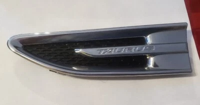 Ford Taurus 2010-2019 emblema del lado izquierdo del conductor guardabarros moldura cromada OEM Foto 1 de 2