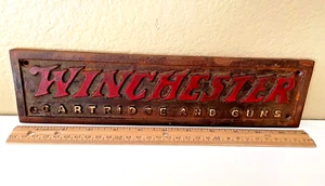 Winchester Cartridges and Guns Wall Plaque Antiqued Cast Iron 12 inches long - Picture 1 of 6
