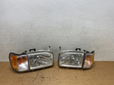 Juego de faros halógenos laterales izquierdo+derecho Nissan Pathfinder 1999-2004 OEM T3240 DG Foto 1 de 4