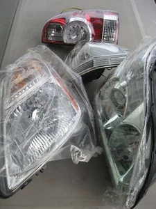4 new Parts 4 Toyota HEADLIGHT, TAIL, TURN, NO ID ON THESE PARTS. YEAR? - Picture 1 of 8