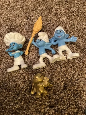 Stitch gold McD toy with 3 Smurf McD toys Clumsy, Chef, & Crazy 2011 - image 1 of 3