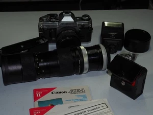 Canon AE-1 Film Camera w/Filters, Flash, Hood, Power Winder, 2 Lens  - Bild 1 von 1