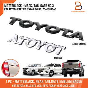 Logotipo emblema insignia puerta trasera Toyota negro mate para todas las camionetas Hilux 2005-2025 - Imagen 1 de 7