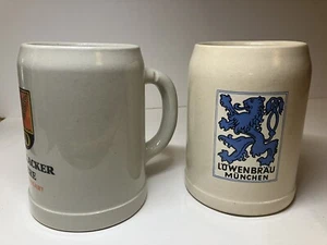 2 Keramik Deutsche Bierkrüge 0,5 Liter Lowenbrau Dinkelacker - Bild 1 von 12