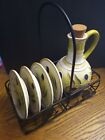 Olive Oil Decanter and 4 Plates In A Metal Rack With Olive Pattern