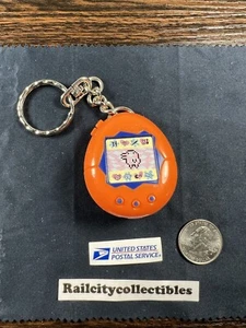 Portachiavi Tamagotchi giocattolo McDonald's vintage 1997 arancione blu Happy Meal - Foto 1 di 8